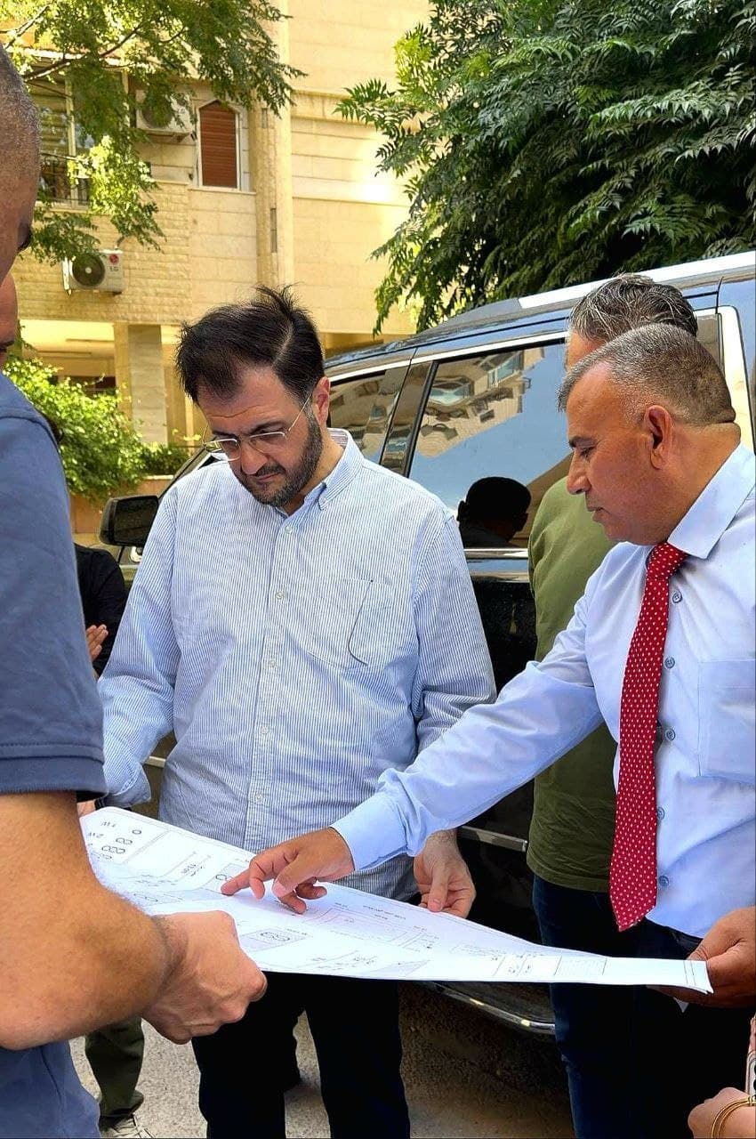 Infini Net engineers reviewing network route plans on site